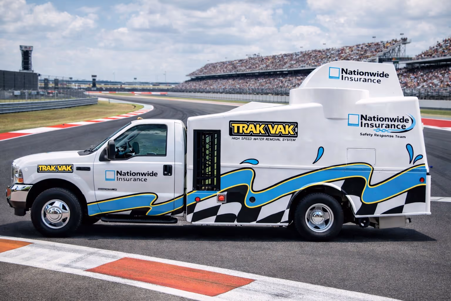 Trak Vak race track dryer drying an asphalt surface